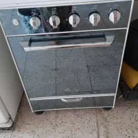 اجاق گاز طرح فر فندک دار و سماور برقی و جارو برقی