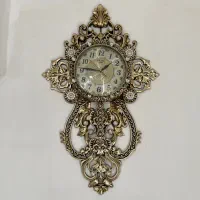 ساعت دیواری طلایی