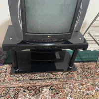 تلویزیون ۲۴ اینچ ال جی و میز شیشه ای