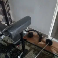 میز ۱۲ کاره ب همراه هالتر ۳۰کیلو وزنه و دنبل.