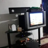 زیر تلویزون و فرش