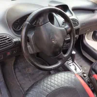 پژو ۲۰۶ صندوق دار (آریان) سفید اتوماتیک