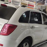 شیشه دودی سرامیکی uvضمانتی پویا|خدمات موتور و ماشین|سنندج, |دیوار