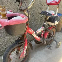 دوچرخه سایز ۱۲ قرمز مشکی آلمینیومی آکبند درحد نو