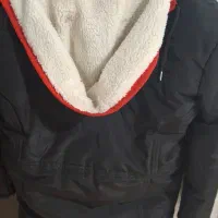 کاپشن|لباس|اهواز, کوی باهنر|دیوار