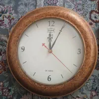ساعت دیواری و ایستاده چوبی