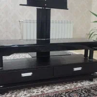 زیر تلوزیونی چرمی وشیشه ای بسیار زیبا وسالم