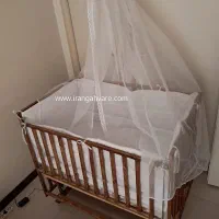 گهواره کنار تخت مادر