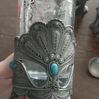 لیوان چای با قاشق .پیوتر نقره کوب