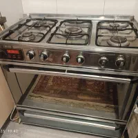 اجاق گاز فردار. فرش. میز تلویزیون.آینه قدی