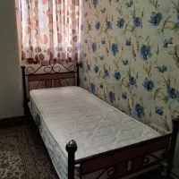 تخت یک‌نفره به همراه خوشخواب دوطرفه پددار طبی
