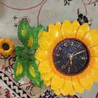 ساعت دیواری پاندول دار طرح آفتاب گردان