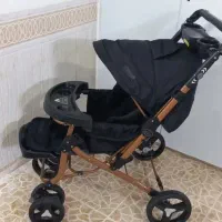 کالسکه کودک بدنه برنزه در حد چند بار استفاده شده