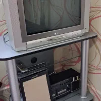 فروش تلویزیون ال جی اصل کره به همراه میز تلویزیون