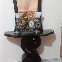 آینه کنسول ساعت و شمعدان.