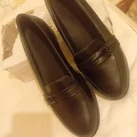 کفش نو و کوله پشتی