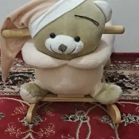 راکر .ست حمام .کریر و تعدادی لباس و کفش نوزادی