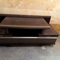 یک عدد میز تلویزیون چوبی یک جفت باند الجی تمیز