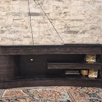 میز تلویزیون مدرن شیشه‌ای و طراحی شده با ام دی اف