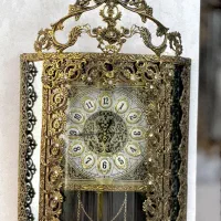 تعدادی  وسایل برنجی لوستر ، ساعت ایستاده و ...