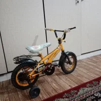 دوچرخه سایز ۱۲ درحد نو با کمکی مارک خارجی