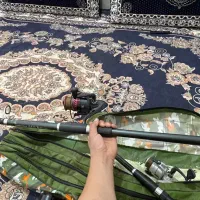 دو عد چوب ماهیگیری با چرخ ماهیگیری