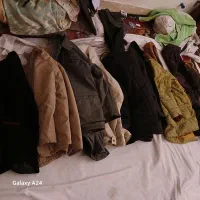 لباس زنانه ومردانه به همراه کاپشن وشلوار.