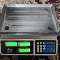 ترازو و ماشین حساب