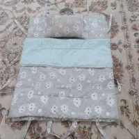 رختخواب مسافرتی نوزاد و پتو دورپیچ خز دار