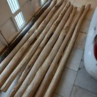 گهواره کودک و تیر و تخته چوبی