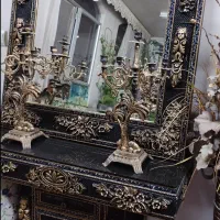 ساعت ایستاده اینه شمعدان