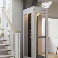 بالابر و آسانسور و هوم لیفت بین راه پله و شیشه ای