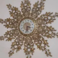 ساعت برنزی طرح خورشید سنگین