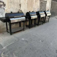 باربیکیو پلوپز کنار محفظه استیل کباب پز منقل تابشی