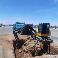 مینی بیل زنجیری . کانال . خاکبرداری.شفته