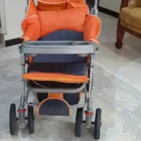 کالاسکه بچه رنگ نارنجی طوسی تمیز و سالم