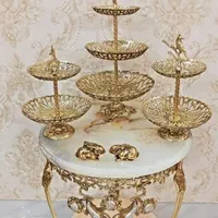 ساعت مجسمهای و وسایل پذیرایی برنز
