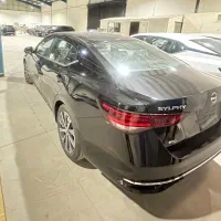 تنها نیسان سیلفی آمیتیس هیبرید 2025/2026 سندی مشکی