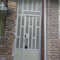 درب آهنی،لوستر برنز،سنگ اپن،روشنایی،کابینت