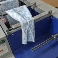 دستگاه رول کن و بسته بندی کیسه و سفره