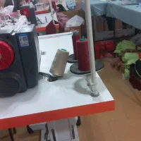 چرخکار،دکمه و مادگی زن ،اتو کار،وسط کار خانوم