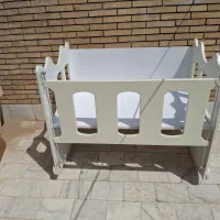 گهواره کنار تخت مادر