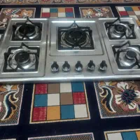 گاز صفحه ای و گلیم و ساعت ایستاده