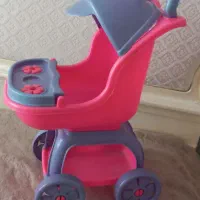 کالسکه اسباب بازی و عروسک پولیش