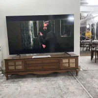 تلویزیون TCL 75 اینج با میز