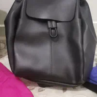 تعدادی کیف و لباس نو