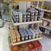 استند قفسه وسط مغازه عطاری سوپر آجیل خشکبار