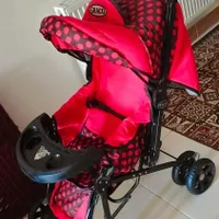 کالسکه بچه رنگ قرمز نو نو