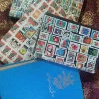 4تا البوم همراه 620 عدد تمبر پهلوی خارجی وسکه 1/2