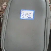 یک عدد . کیف با مدارک به نام خانوم ریحانه رضایی